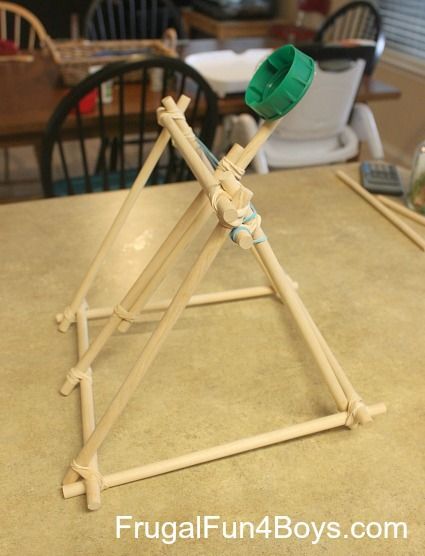 A mini catapult made from wooden dowels